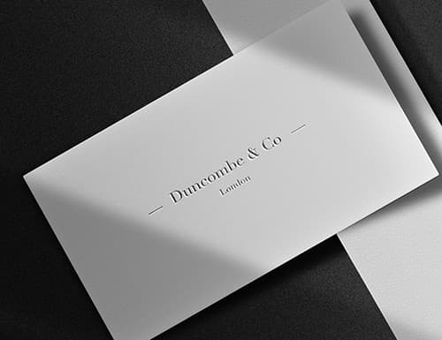 Business card with a logo of Duncombe & Co